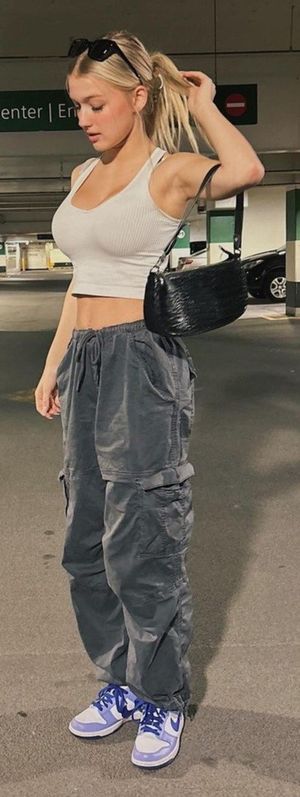 Emma hand in hair in parking garage