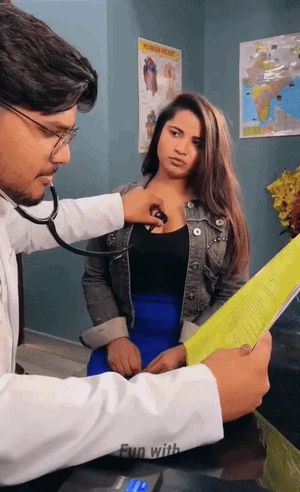 Indian doctor listening to chick’s heartbeat with a stethoscope.