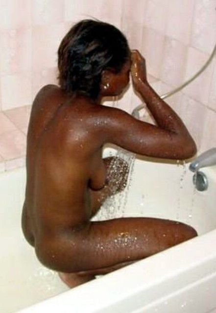 Ebony with sweet buttocks bathing