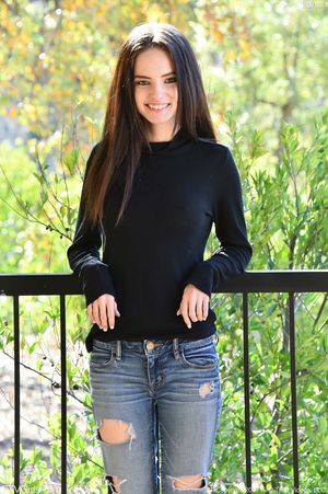 Beautiful teen Lana Adams in ripped jeans bares her tits and bald twat on balcony #1