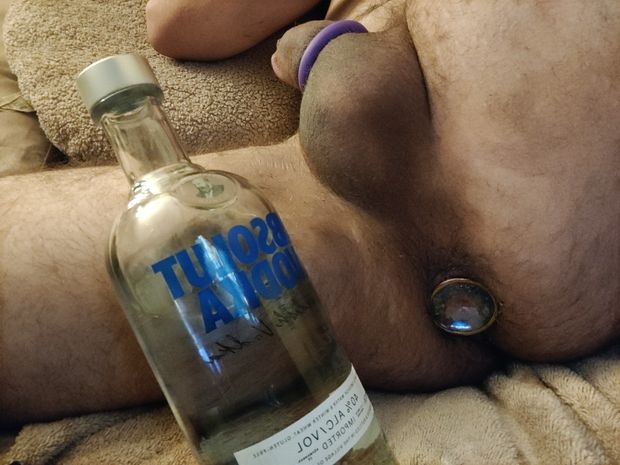 Plugged my ass, cock ring is on, my drink is nice and stiff just like my cock
