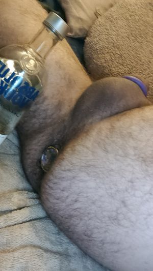 Just jerking while plugged, cock is as stiff as my drink
