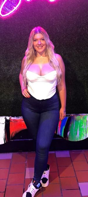 Destiny in front of sign