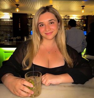 Kate at table with drink