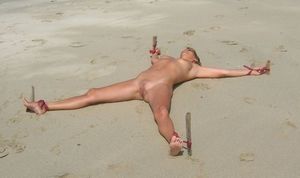 bound spread eagle and exposed outside