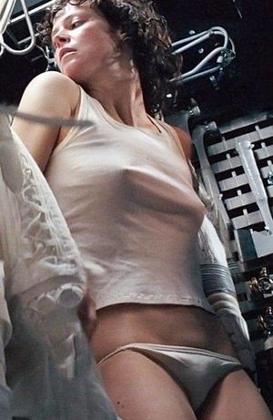 Sigourney Weaver nipping out in a scene from the 1979 movie Alien & also flashing a bit of her dark hairy trim that is peeking out