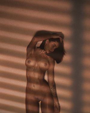 hot brunette showing big silicon bimbo tits