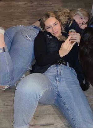 Friend laying on Keyra showing ass