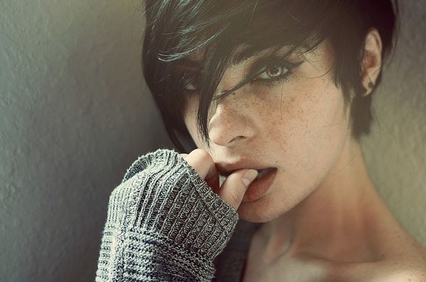 Cute tomboy biting her finger