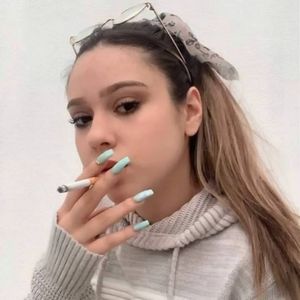 Gorgeous teen smoking