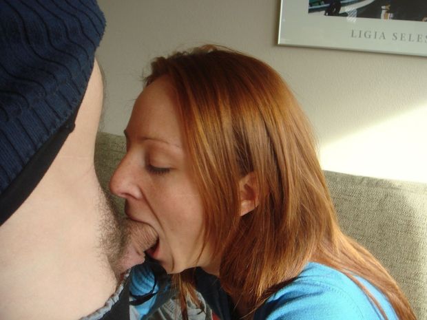 Amateur redhead shoving some cock in her mouth