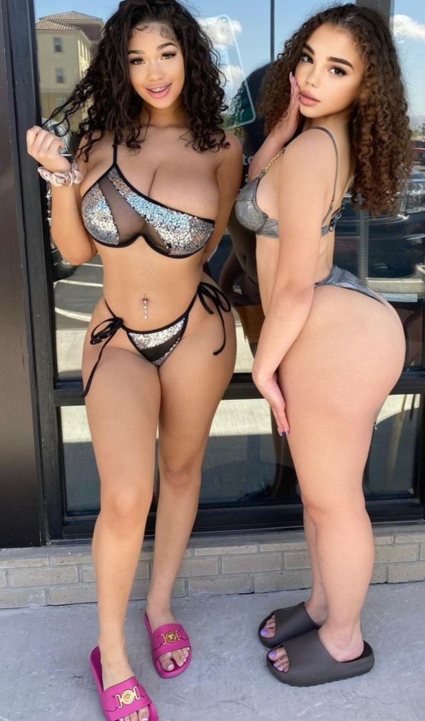 Lexie & friend in front of store window