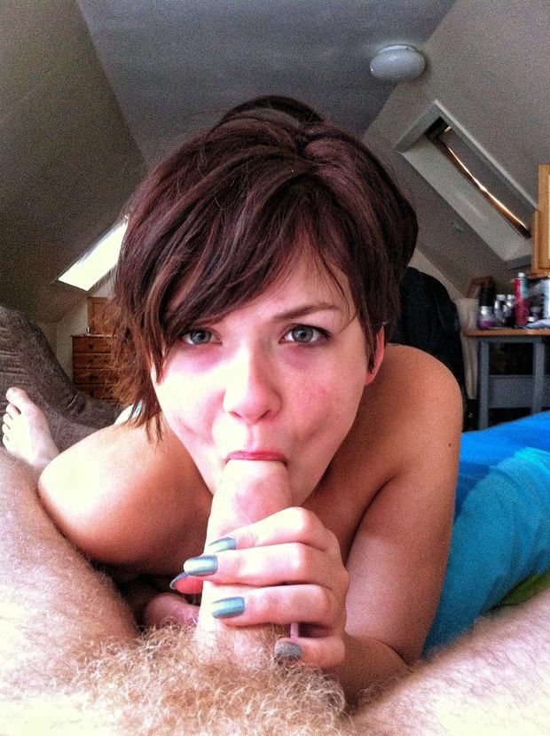 Pretty short-haired brunette MILF sucking a cock