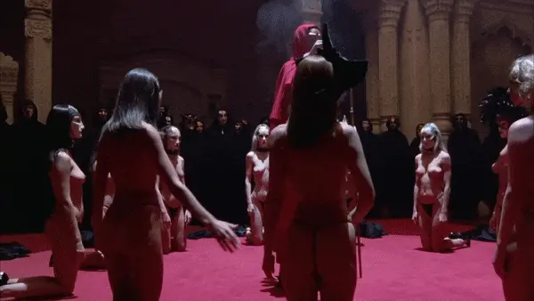 Exquisite ladies passing a stylized kiss during the orgy preparation ritual 2 - Eyes Wide Shut Orgy