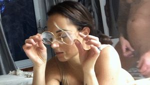 Takes off her cum covered glasses as she's fucked from behind