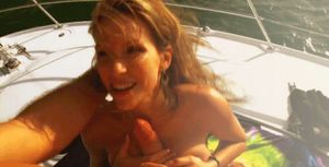 cute chick is happy with invitation on yacht