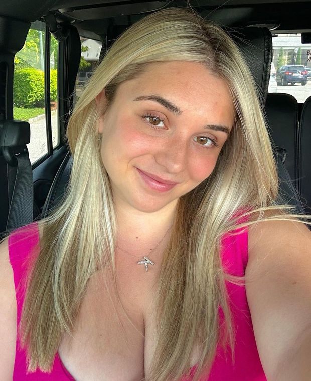 Kate pink top selfie in car