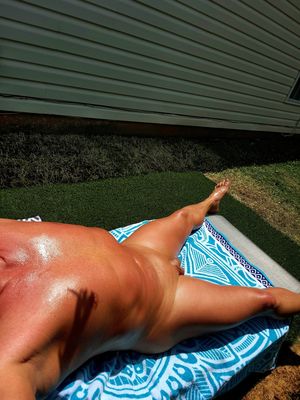 Tanning in the yard on a hot Saturday