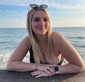 Keyra sitting at picnic table