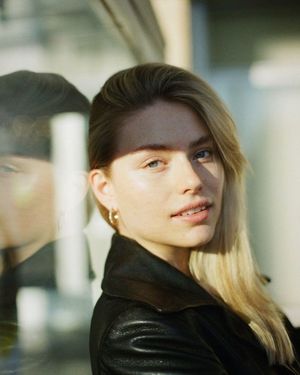 You see a black leather jacket. But her lover gets to see the sleeveless blouse underneath. And a skirt with no panties