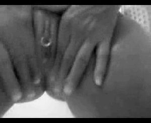 She cums while stroking her wet shaved pussy