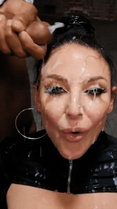 this slut has her face drenched in cum