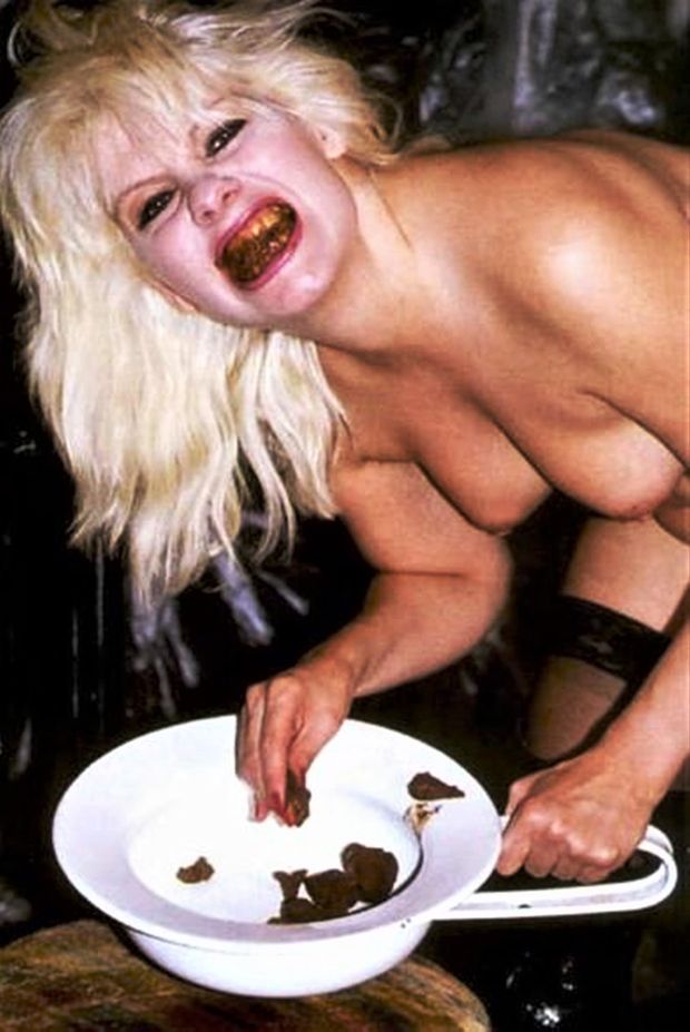 This hot slut is eating shit out of a porta potty!  She loves this acitvity!  Who are we to deny her!?