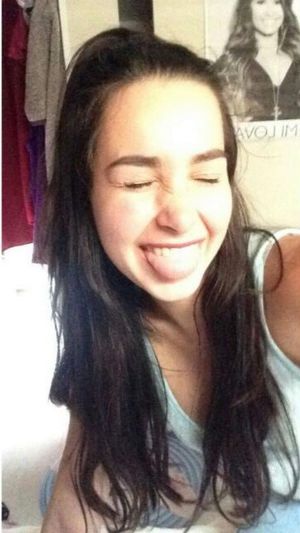 Shy teen doesn't want to look in the camera