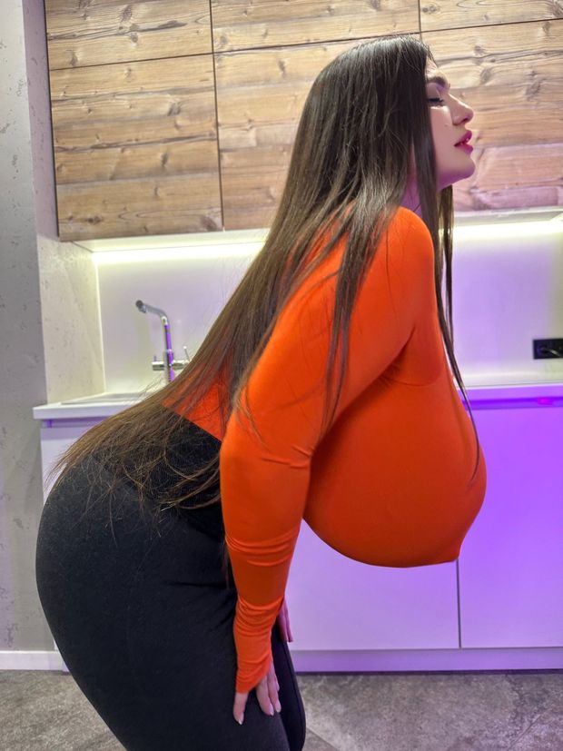Bending forward with large tits