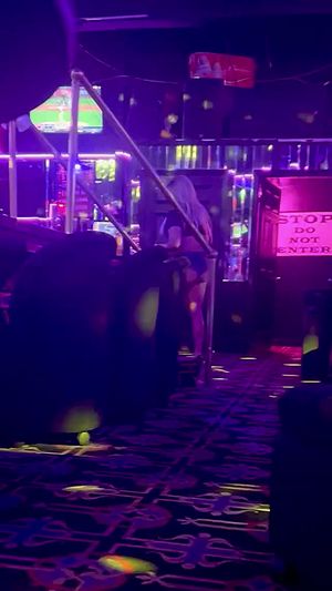 Sexy babe wearing hot shorts in a strip club.