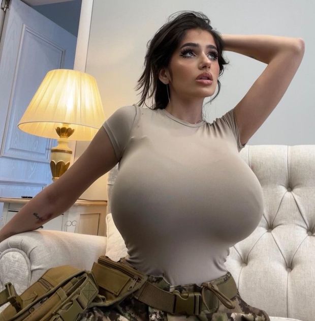 Julia in camo on bed