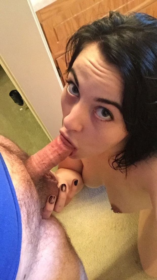 Brunette amateur on her knees sucking an average-sized dick