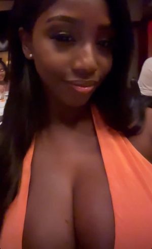 Ellie Mae orange dress close up selfie