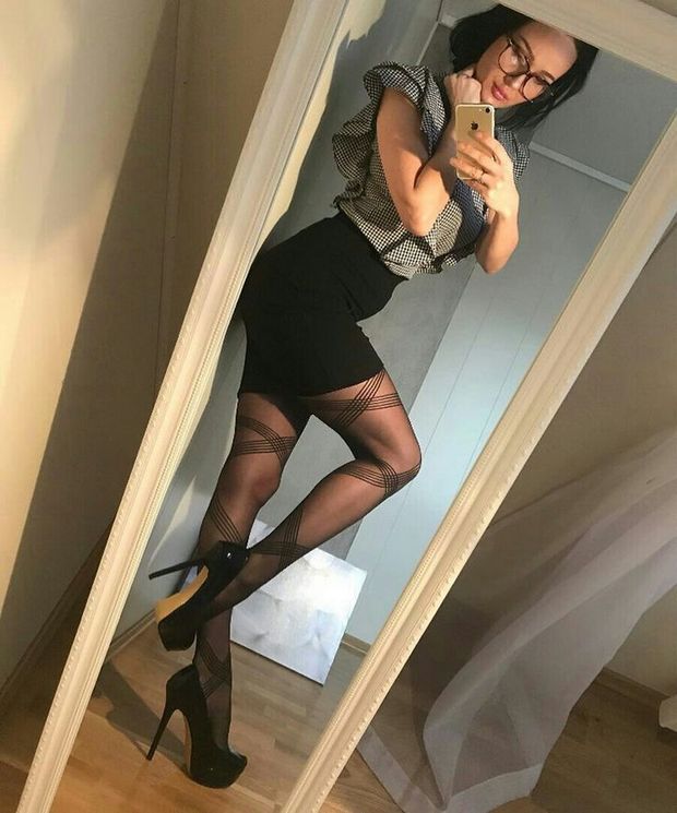 Leggy brunette in tight skirt