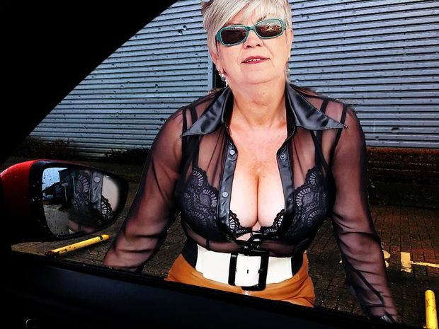 Sandy Ward dressed in sheer clothing and getting into her date's car.