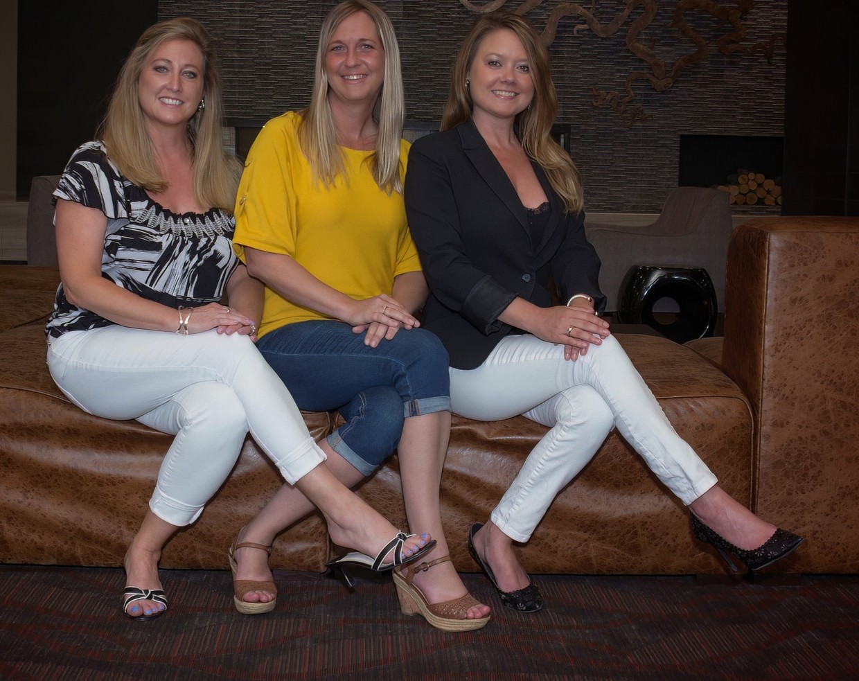 Three blondes in a seat.