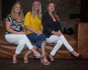 Three blondes in a seat.