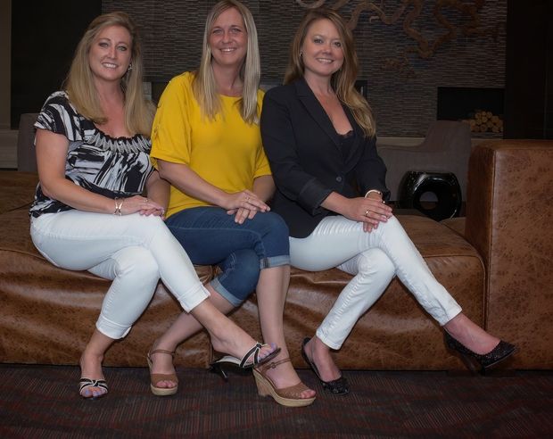 Three blondes in a seat.