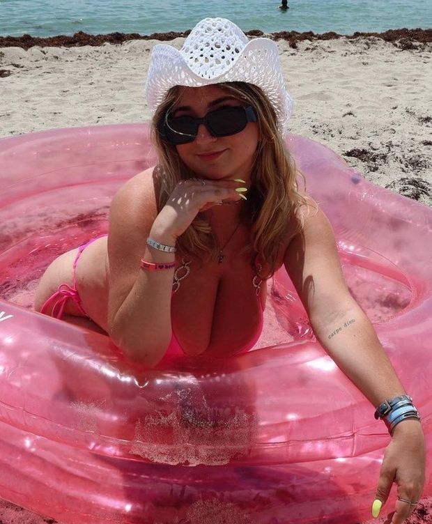 Jolie in tube head on hand