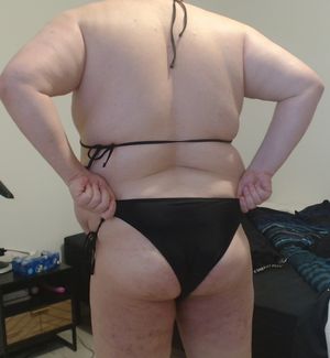 Adjusting my black bikini (back)