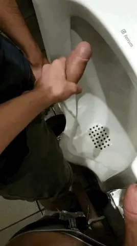 Hand job at the urinal