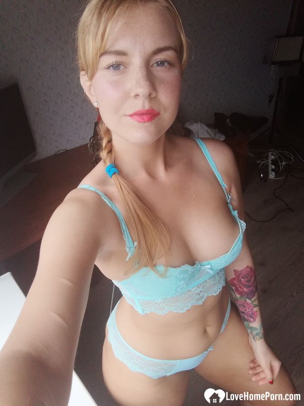 Blue lingerie beauty shows off her curves