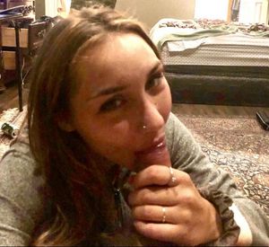 Happy amateur brunette with some dick in her mouth