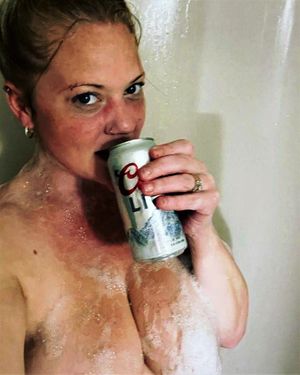 Juliana showering off after some hot dog sex and washing down that thick cum with a cold brew!