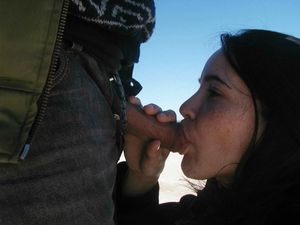 Brunette amateur sucking on an average-sized cock outdoors