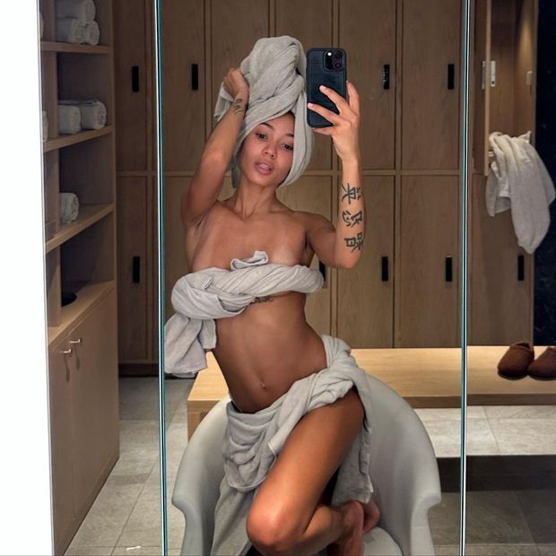 Coi Leray in a towel