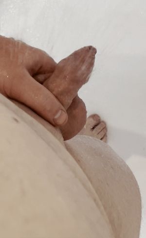Shaking and stroking my soft cock in the shower