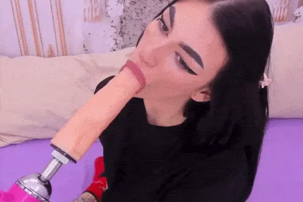 nasty brunette deepthroating a huge dildo