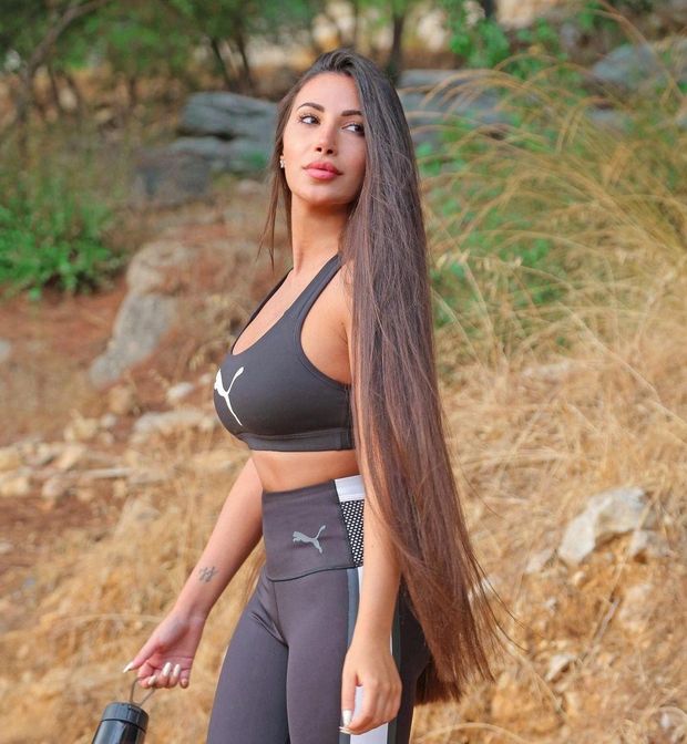Long hair brunette in PUMA gear.