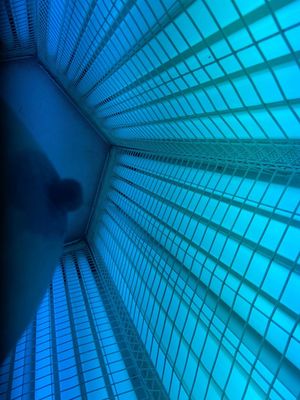 Slutty Co worker showing nipple off in tanning bed